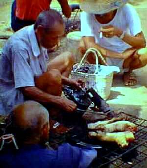 Man cooking with blow torch